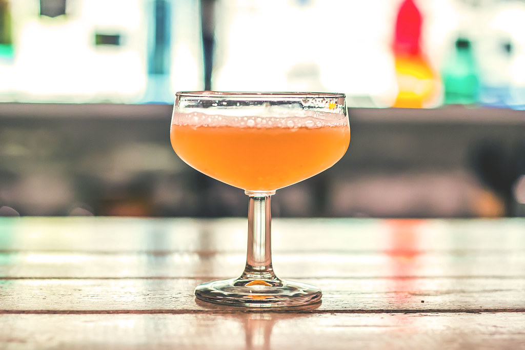 paper plane cocktail in coupe glass